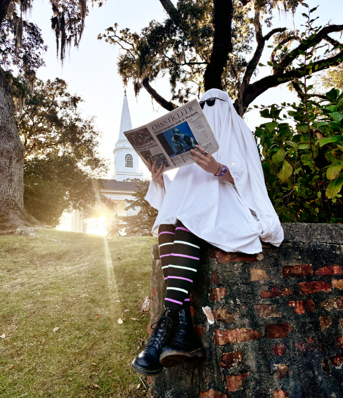 Madisyn Padgett poses with The Chanticleer in Kingston Presbyterian Church cemetery. Photo illustration by Frances Ludwig